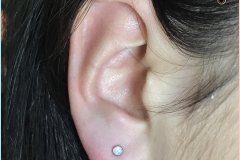 Ear lobe with NeoMetal. Inkhaus Tattoo.