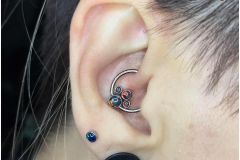 HEALED daith with Anatometal CBR with black and red opal cluster. Inkhaus Tattoo.