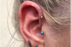 Forward Helix w/ 18k prong set rose gold opal from Anatometal. Inkhaus Tattoo.