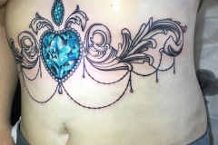 Greyscale Underbust w/ Colour Gem. Inkhaus Tattoo.