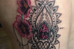 Pink jewel with mehndi pattern and flowers.