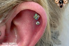 Double helix piercing w/ industrial strength shine gems.
