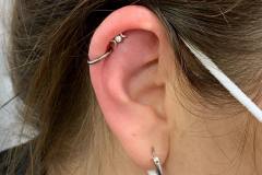 Helix piercing w/ junipurr white gold goddess moon.