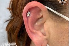 Helix piercing w/ industrial strength marquise cluster.