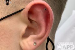 Helix piercing w/ BVLA white gold prong set black diamond.