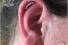 Helix Piercing with Industrial Strength Prium. Inkhaus Tattoo.