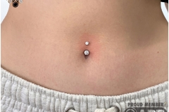 Navel Piercing w/ LeRoi Navel Curve. Inkhaus Tattoo.