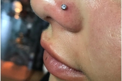Nose piercing w/ 2.5mm NeoMetal CZ. Inkhaus Tattoo.