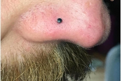 Nose piercing with NeoMetal 2mm black onyx. Inkhaus Tattoo.