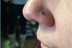Nose Piercing with NeoMetal 2.5mm peacock opal. Inkhaus Tattoo.