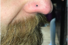 Nose piercing with NeoMetal 2mm black onyx. Inkhaus Tattoo.