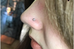Nose piercing with NeoMetal 2.5mm CZ. Inkhaus Tattoo.
