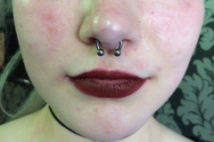 Septum Piercing with Circular Barbell. Inkhaus Tattoo.