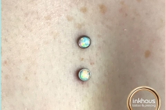 Sternum Surface Anchors with Anatometal Opals. Inkhaus Tattoo.