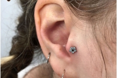 Tragus w/ NeoMetal Flower. Inkhaus Tattoo.