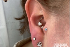 Tragus w/ NeoMetal Aurora Borealis Gem. Inkhaus Tattoo.