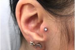 Tragus w/ NeoMetal Opal. Inkhaus Tattoo.