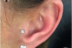Tragus w/ Industrial Strength Swarovski. Inkhaus Tattoo.