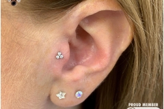 Tragus w/ NeoMetal Trinity Cluster. Inkhaus Tattoo.