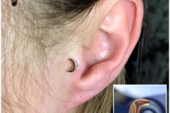 Tragus Piercing with 18k Gold Moon. Inkhaus Tattoo.